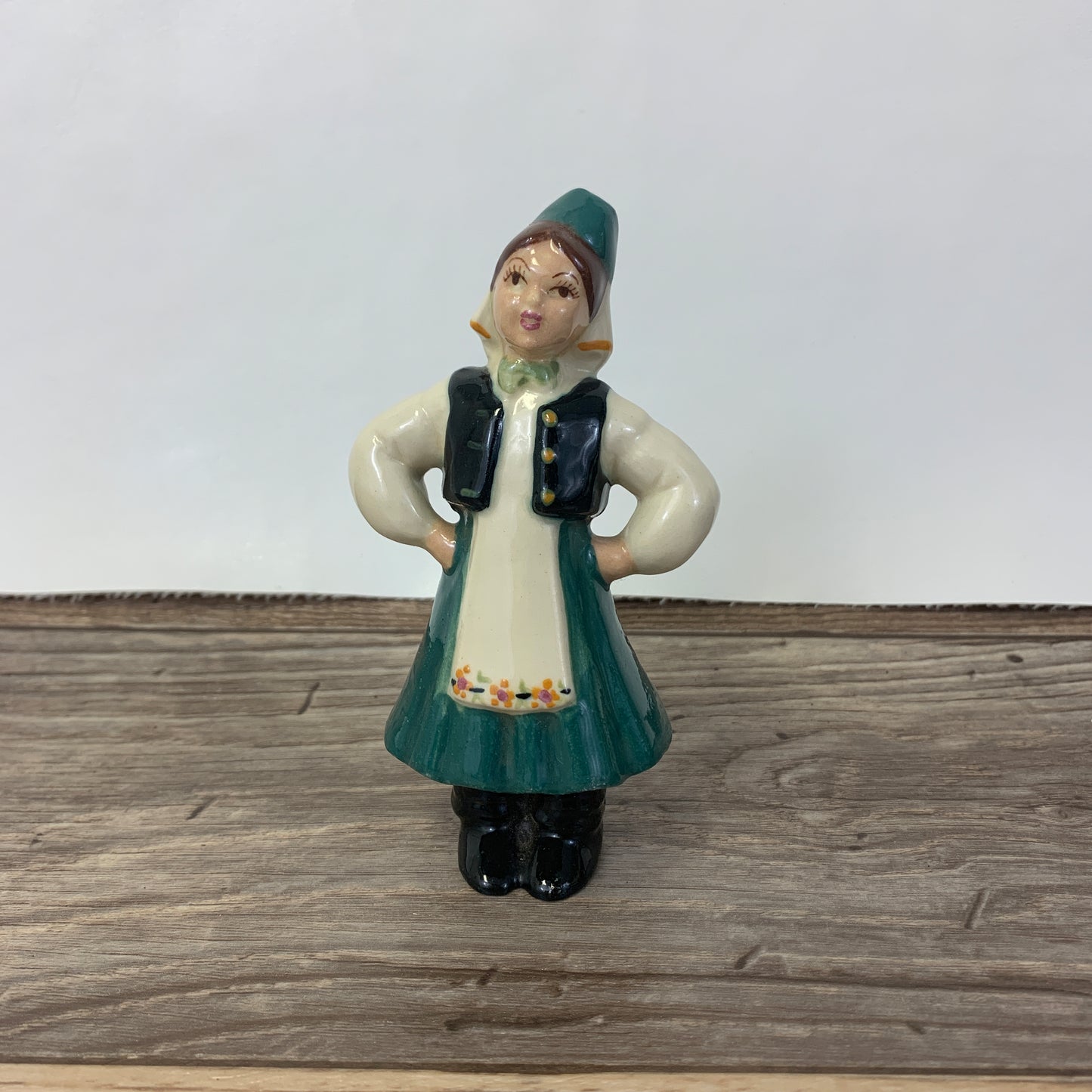 Ceramic figurine of a girl with a traditional Eastern European dress