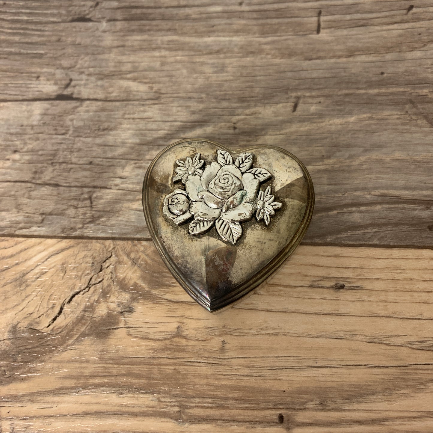 Silver-plated heart-shaped jewelry box with a 3D flower embossing on the lid.
