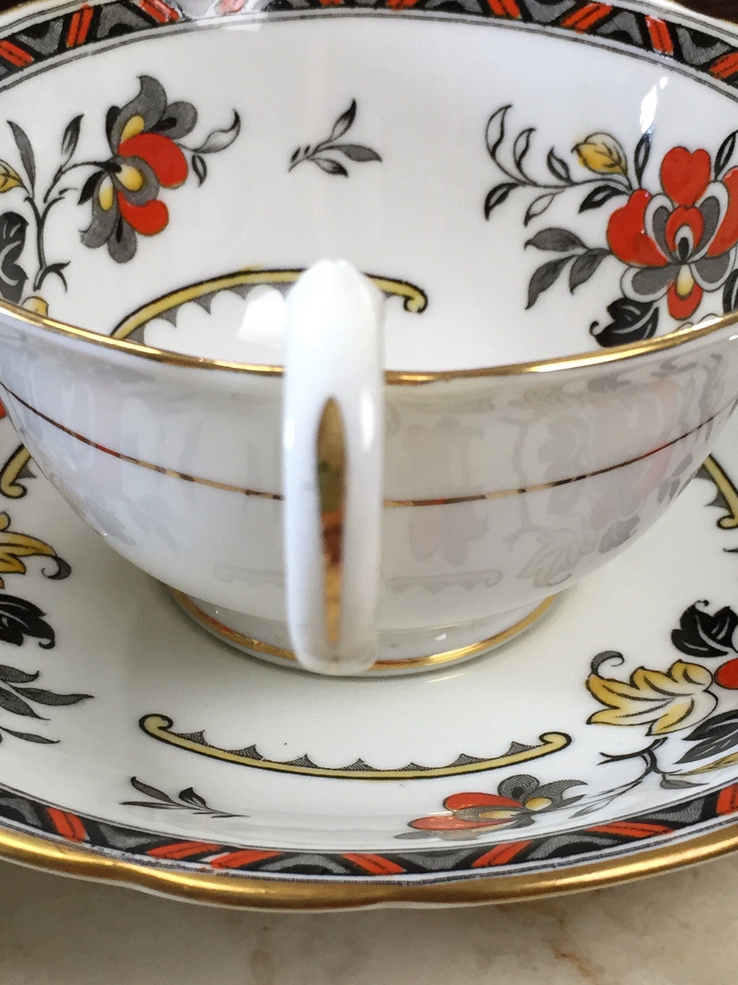 Aynsley Vintage Teacup and Saucer with Black and Orange Pattern