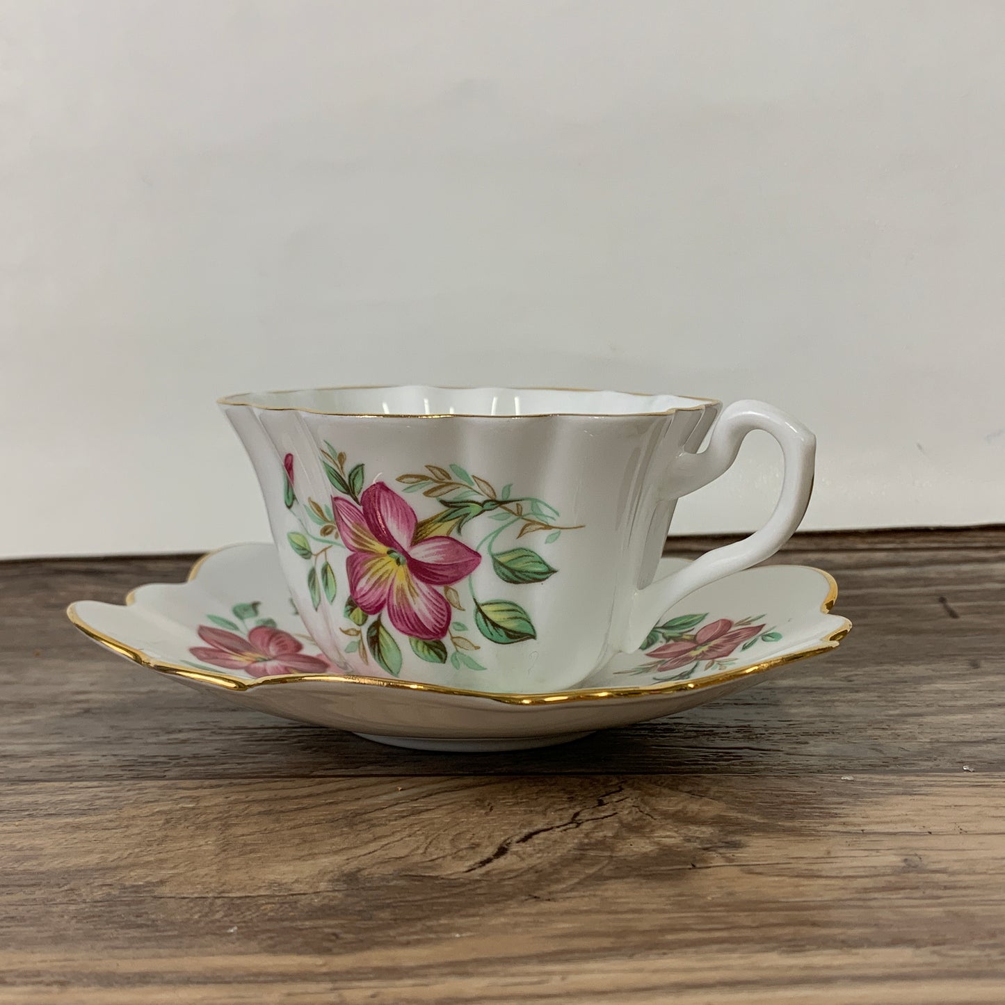 White Tea Cup with Pink Floral Design and Scalloped Edge