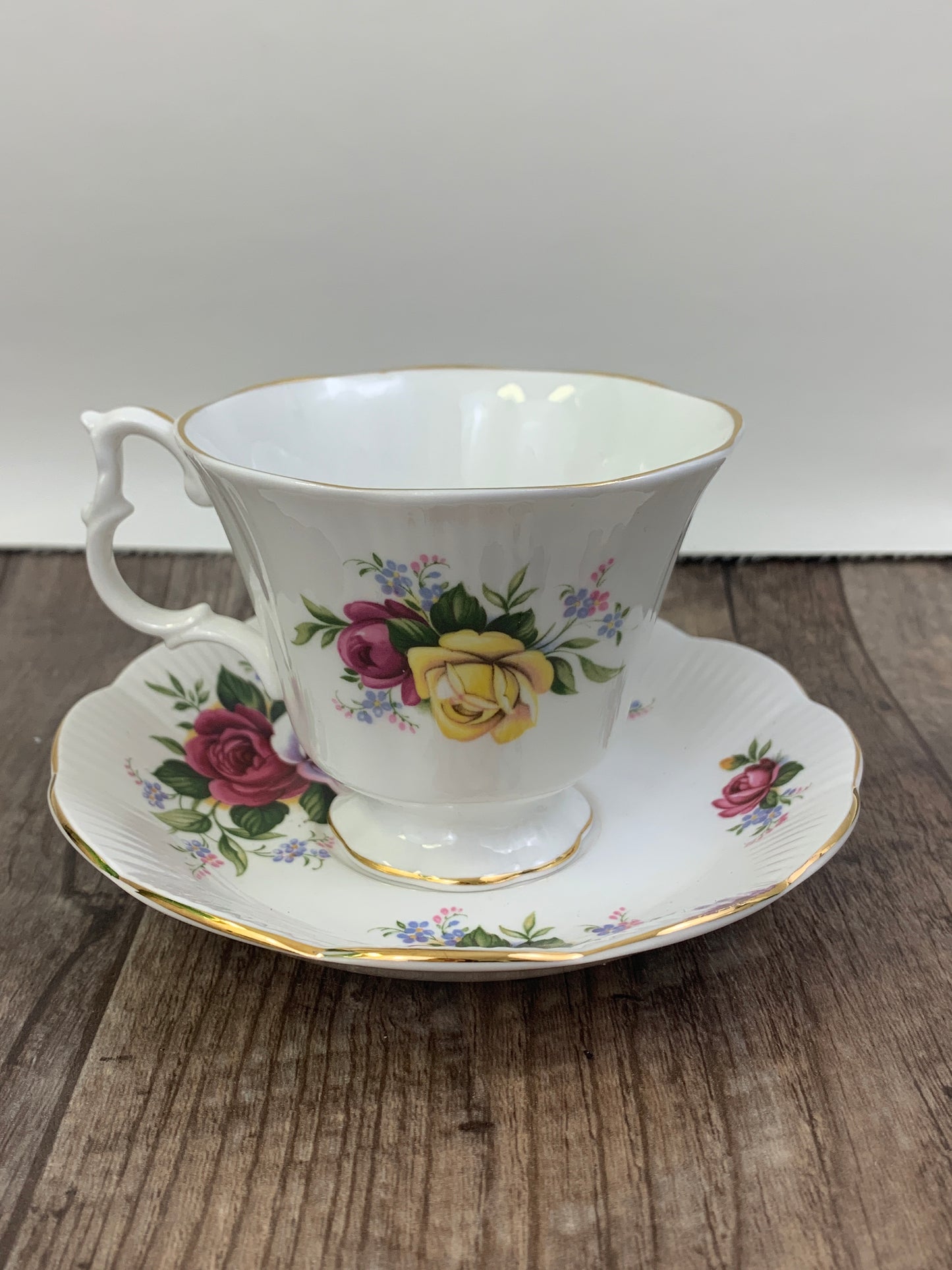 Pink, Yellow, and Red Floral Teacup and Saucer