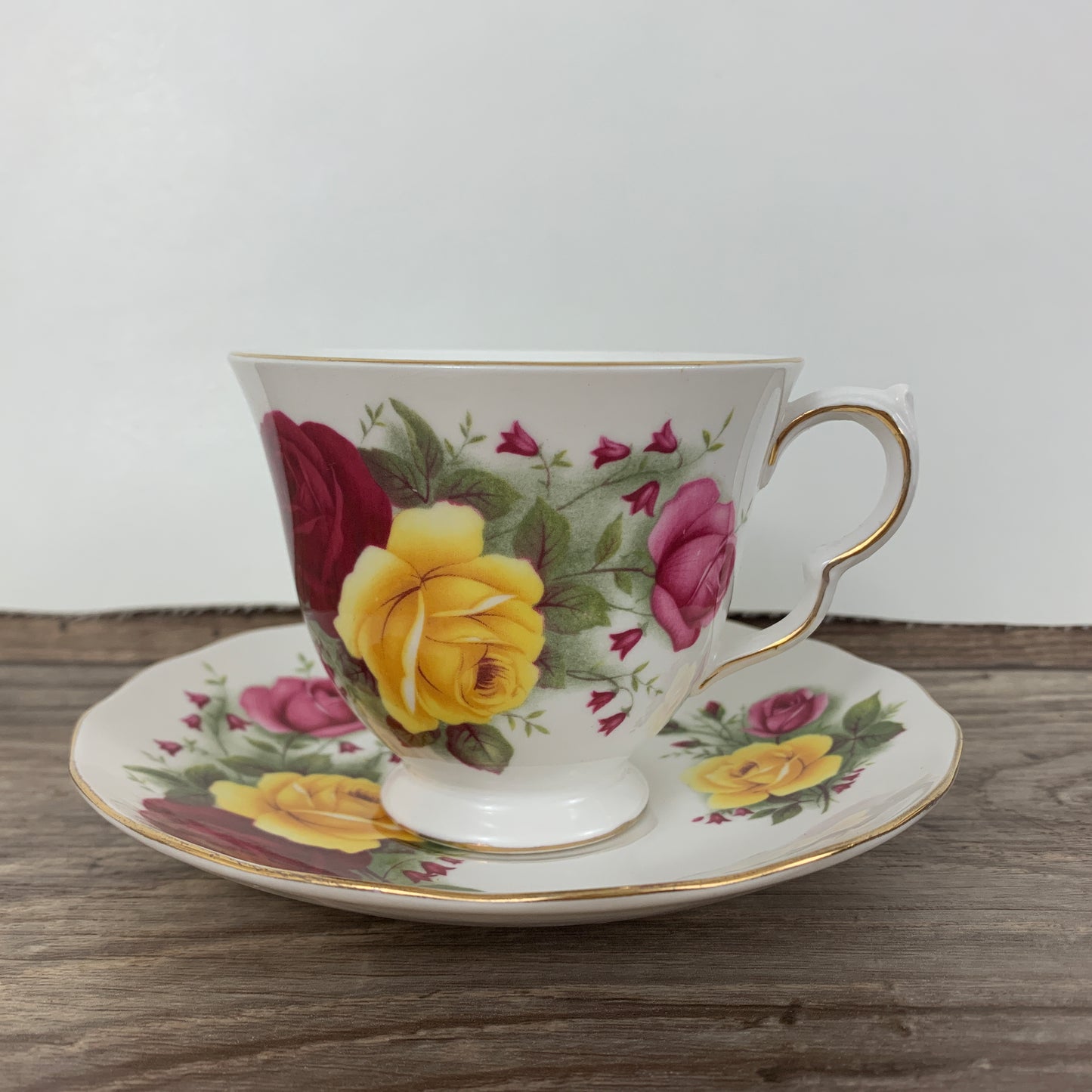 Queen Anne Vintage Teacup with Red, Yellow, and Pink Roses