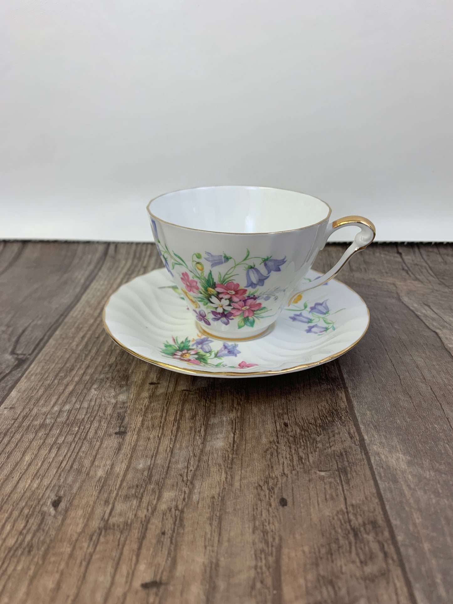 White Vintage Teacup with Floral Pattern Swirled Rib Colourful Flowers