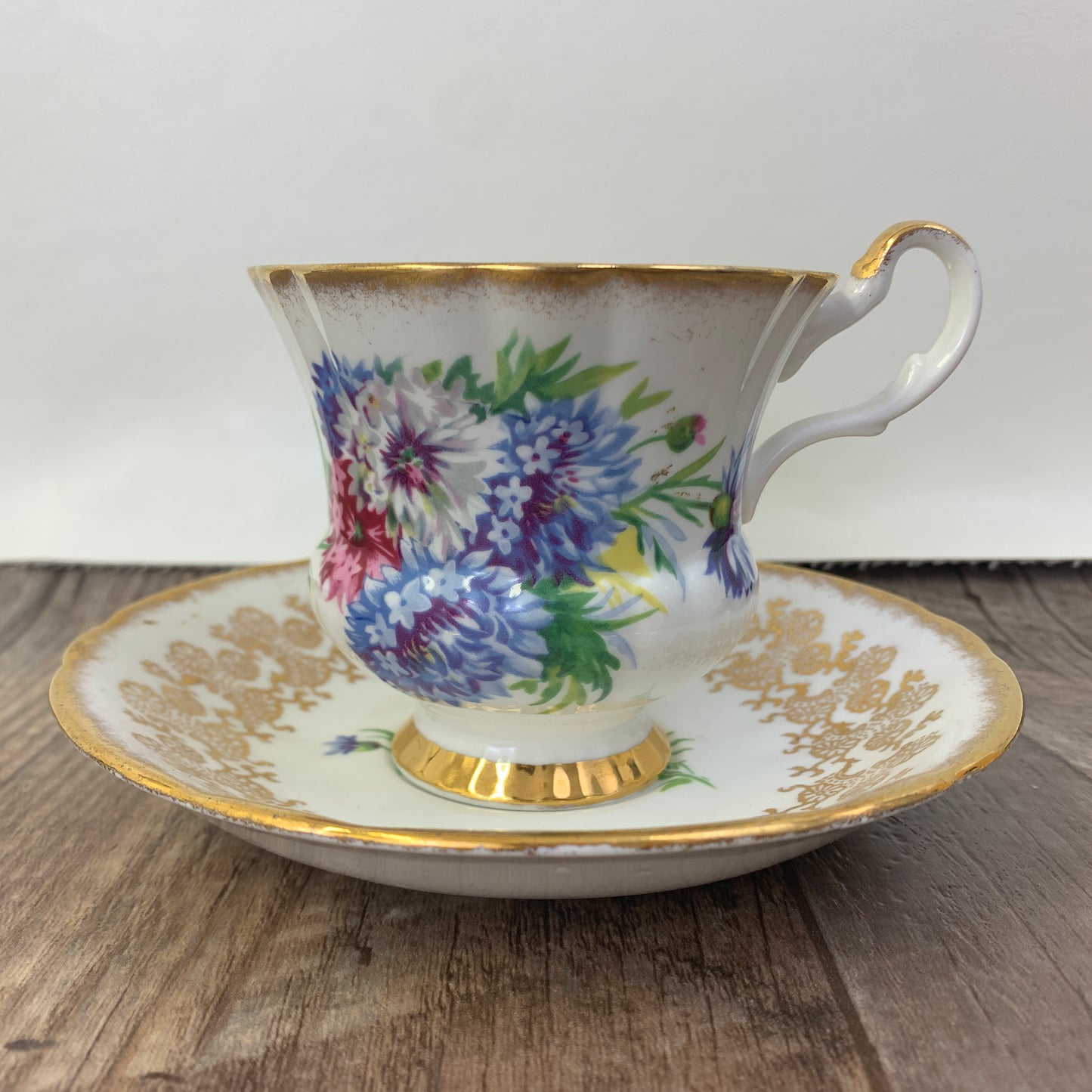 Windsor Bone China Teacup and Saucer with Gold Design, Pink, Blue, and White Floral Pattern