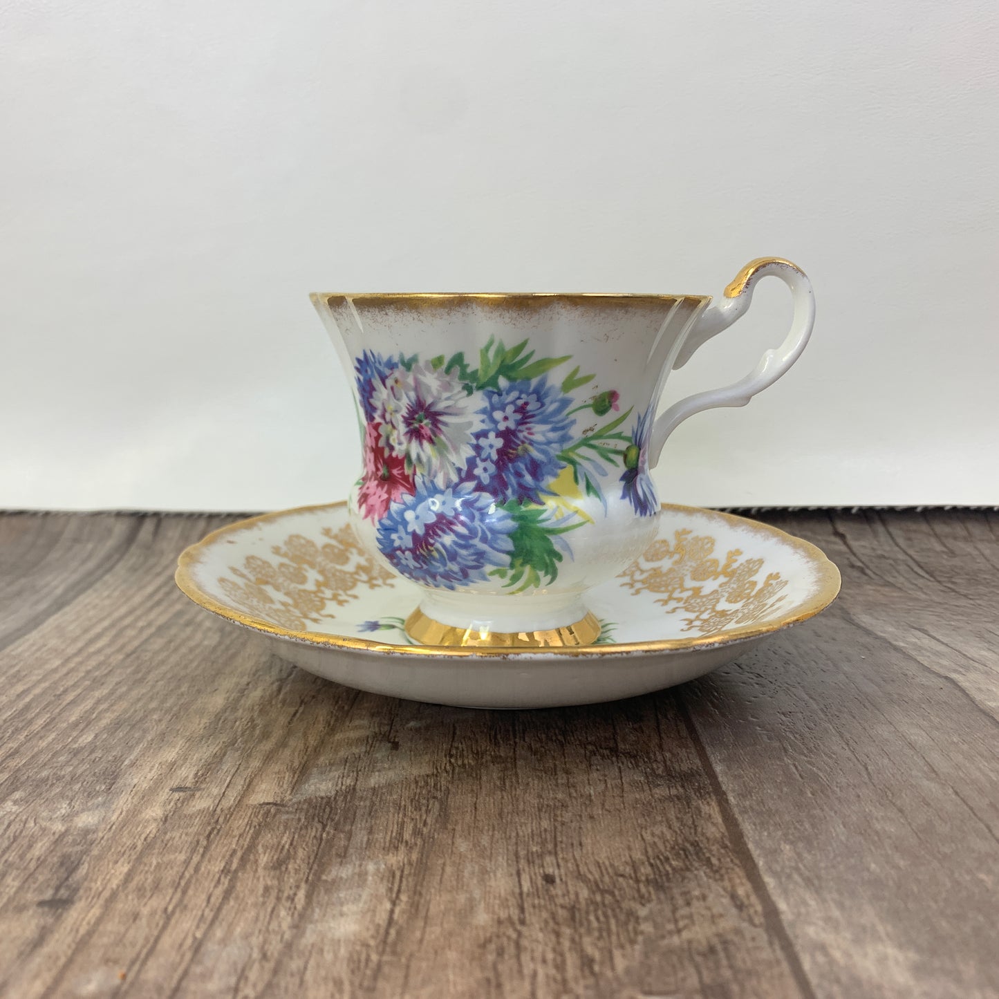 Windsor Bone China Teacup and Saucer with Gold Design, Pink, Blue, and White Floral Pattern
