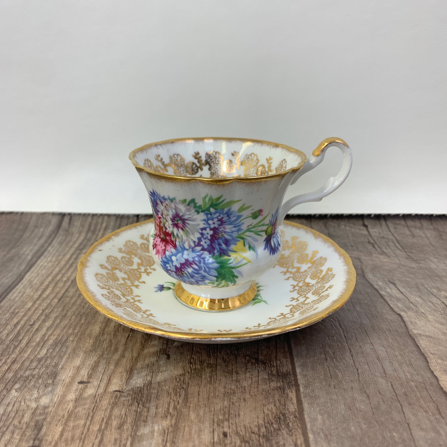 Windsor Bone China Teacup and Saucer with Gold Design, Pink, Blue, and White Floral Pattern