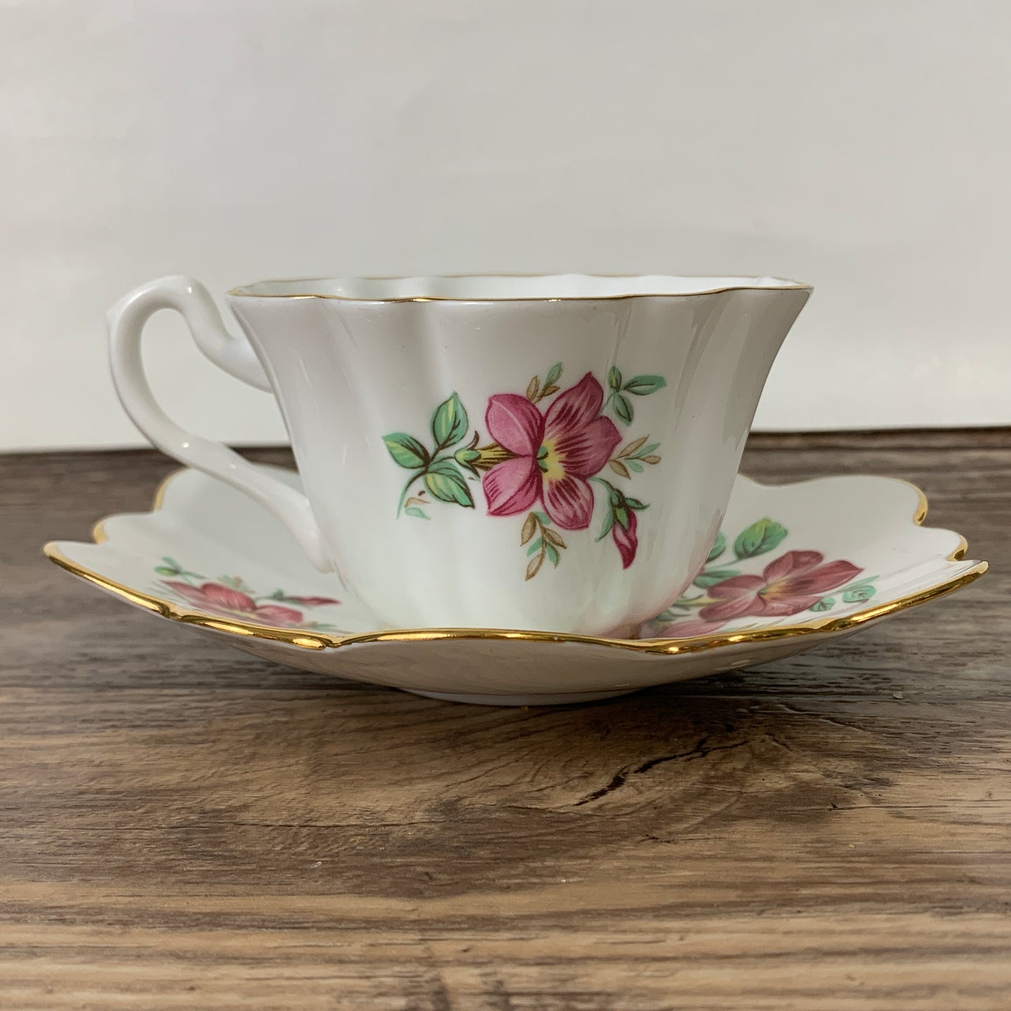White Tea Cup with Pink Floral Design and Scalloped Edge
