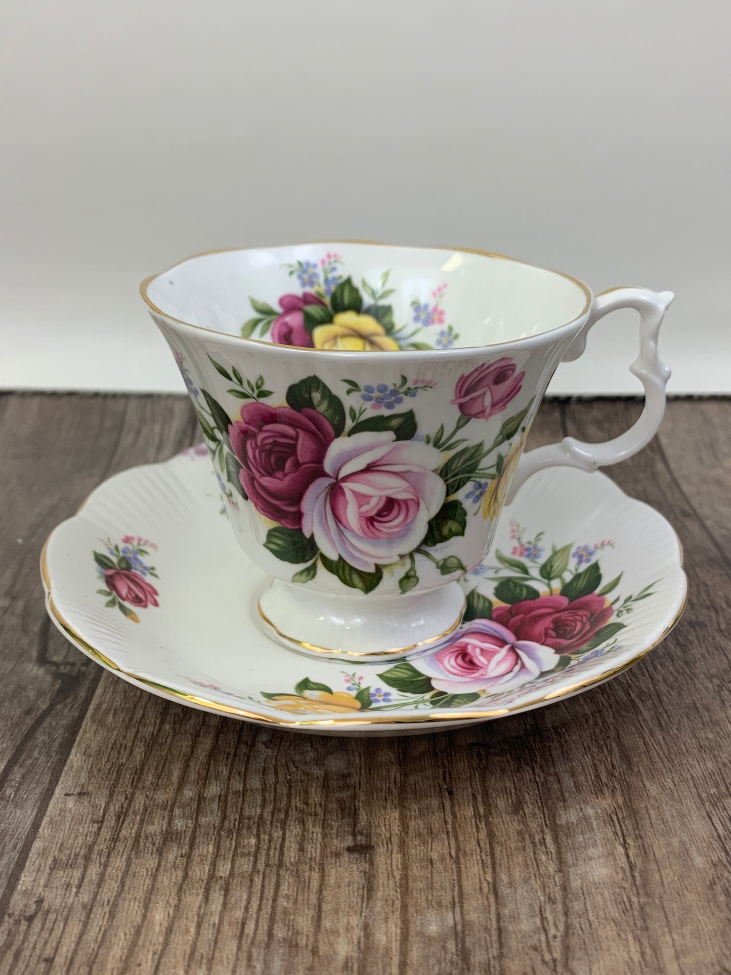 Pink, Yellow, and Red Floral Teacup and Saucer