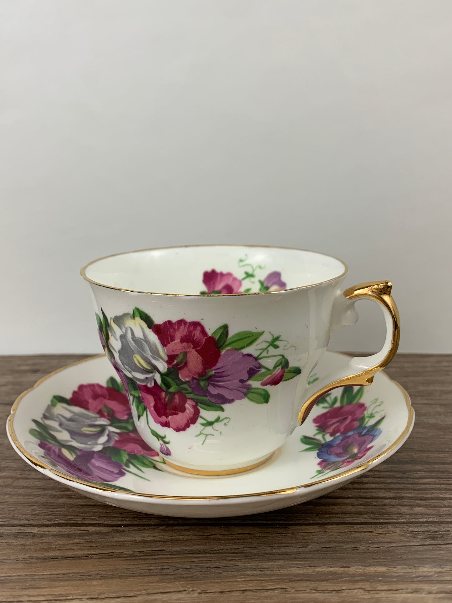 Pink, Purple, and White Floral Vintage Teacup and Saucer by Regency China