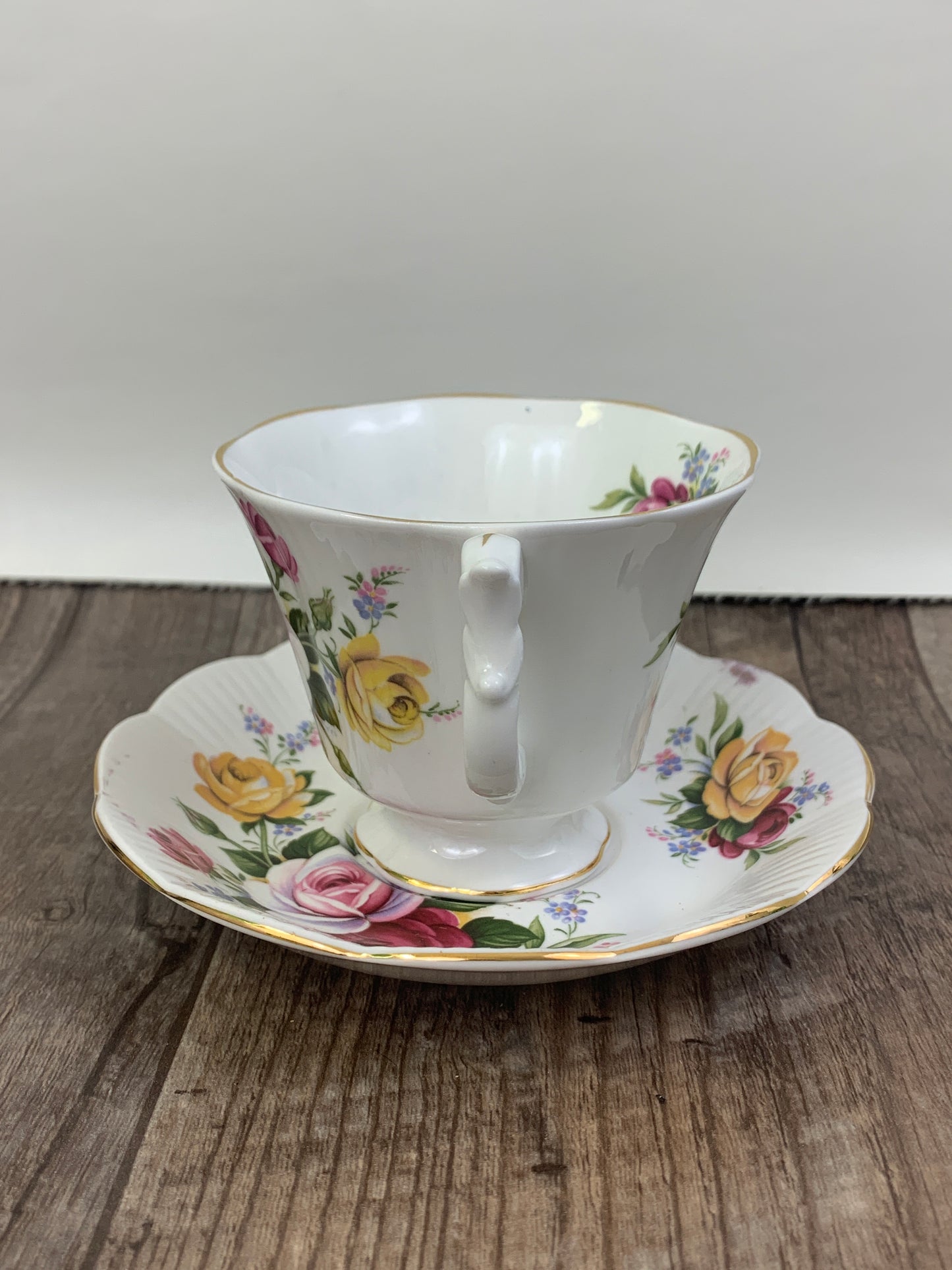 Pink, Yellow, and Red Floral Teacup and Saucer