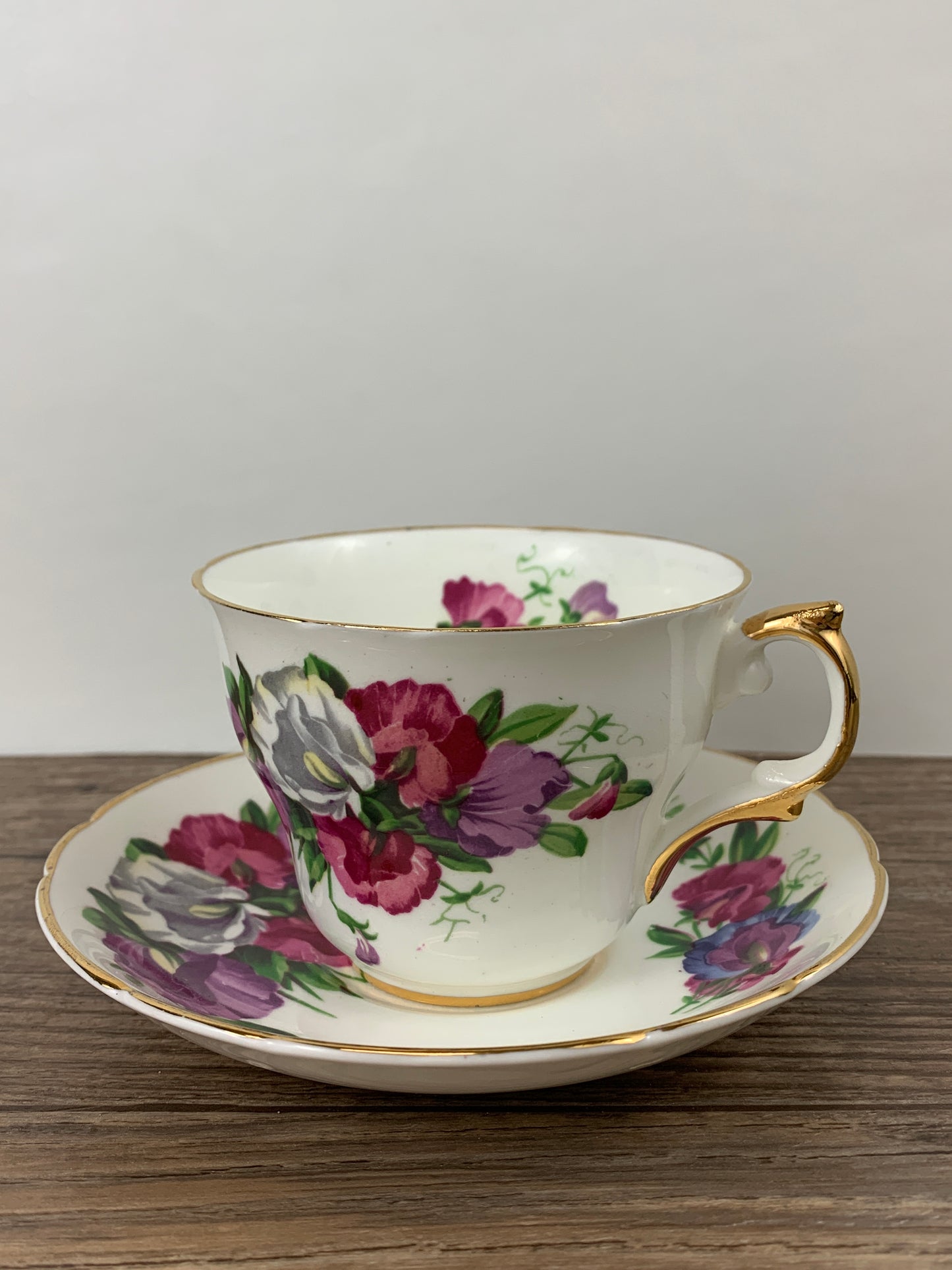 Pink, Purple, and White Floral Vintage Teacup and Saucer by Regency China