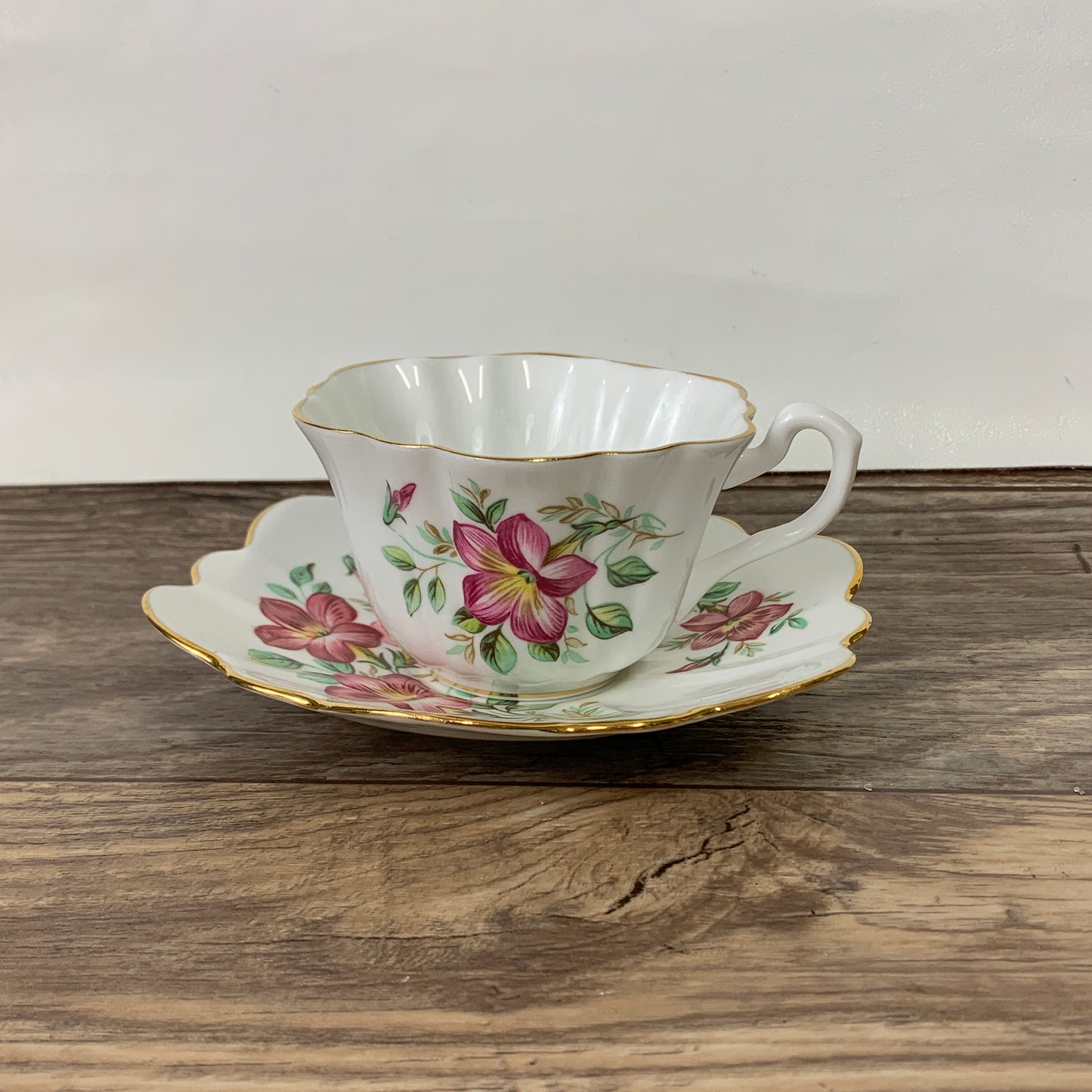 White Tea Cup with Pink Floral Design and Scalloped Edge