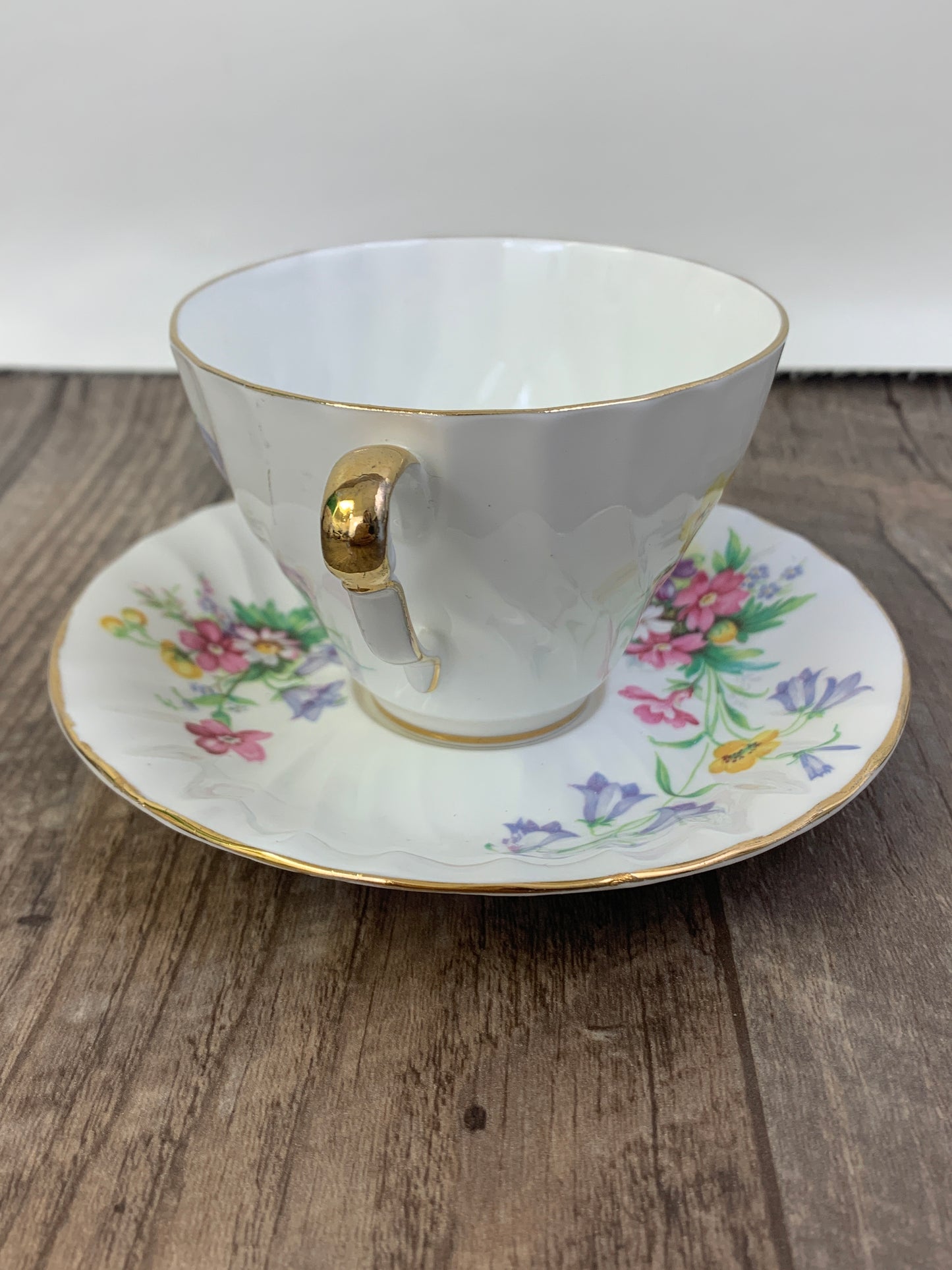 White Vintage Teacup with Floral Pattern Swirled Rib Colourful Flowers