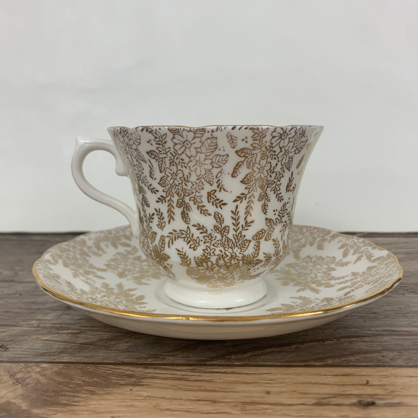White Teacup with Golden Floral Pattern Vintage Royal Vale Tea Cup