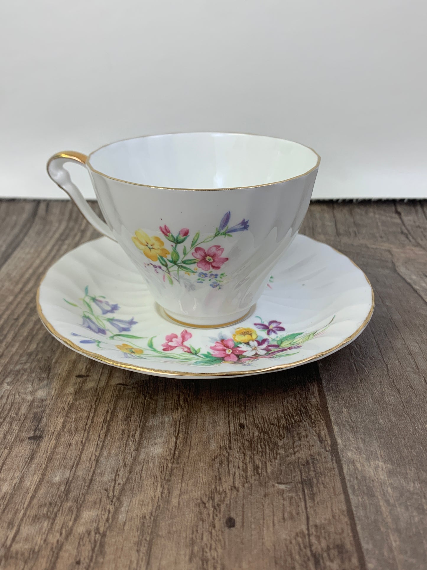 White Vintage Teacup with Floral Pattern Swirled Rib Colourful Flowers