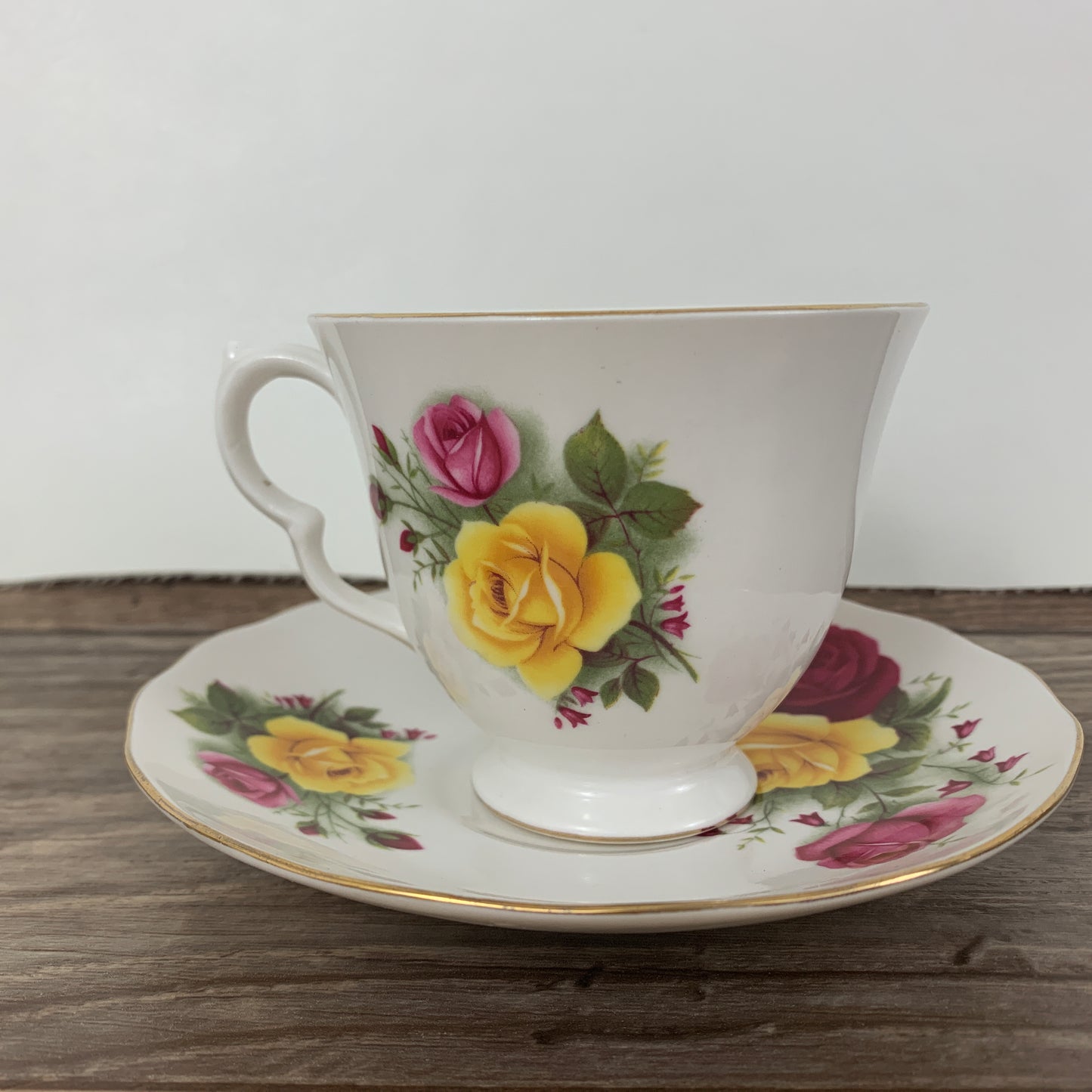 Queen Anne Vintage Teacup with Red, Yellow, and Pink Roses