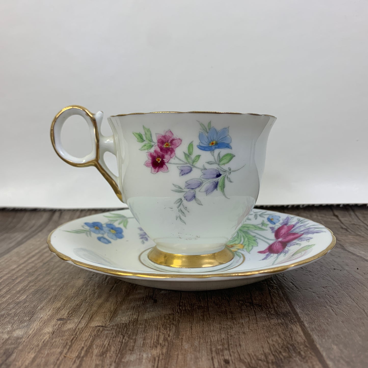 Vintage Teacup Delphine China Hand Painted Tea Cup Pink, Blue, and Yellow Floral Pattern