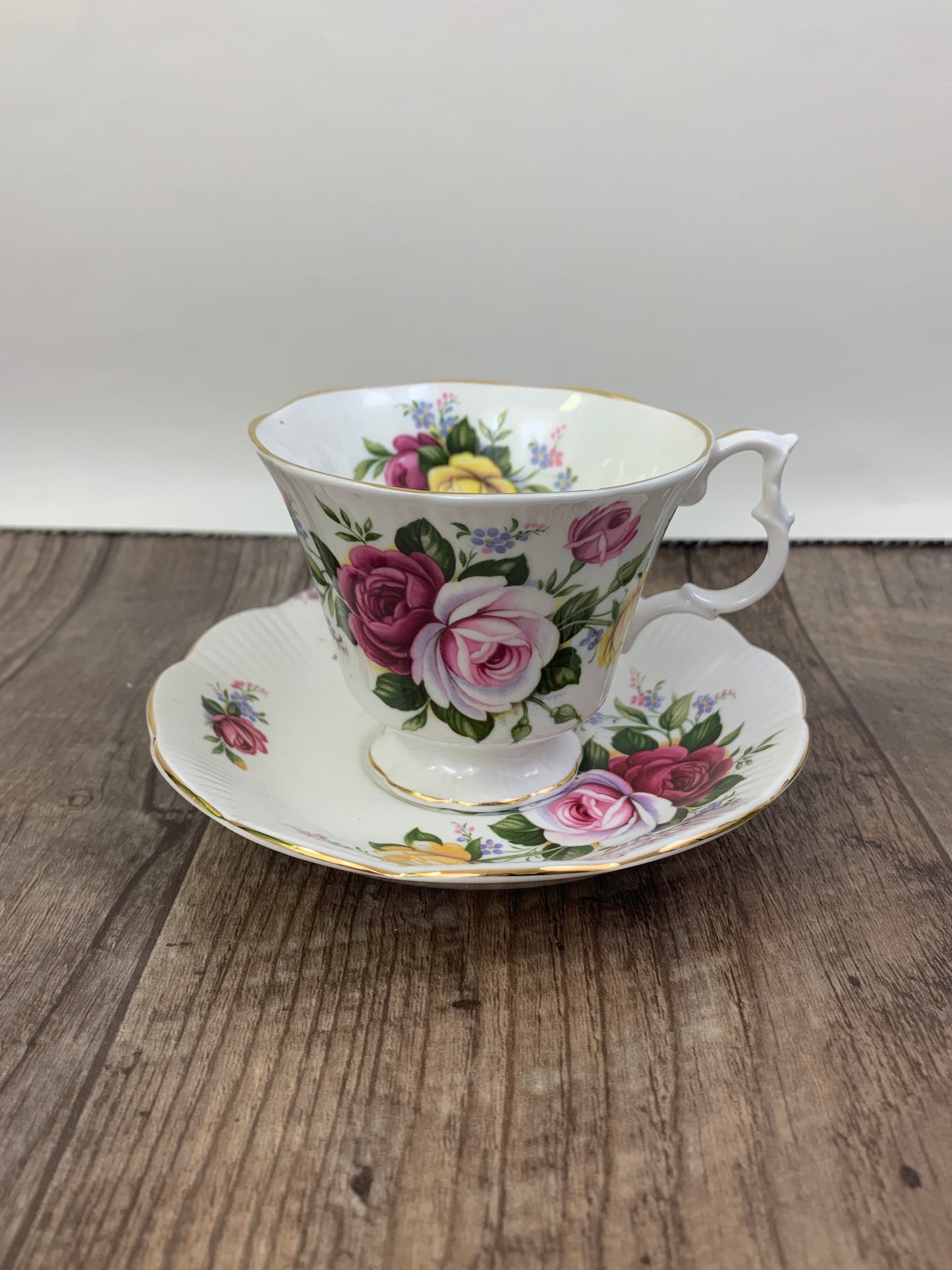 Pink, Yellow, and Red Floral Teacup and Saucer