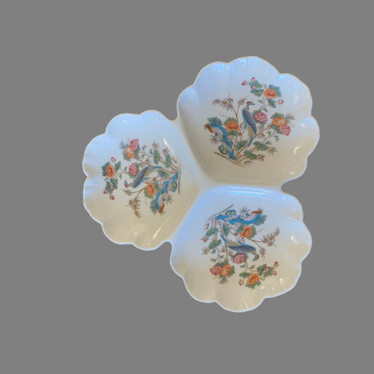 A three-part Wedgwood Kutani Crane pattern china relish dish with floral and crane motifs, on a grey background.