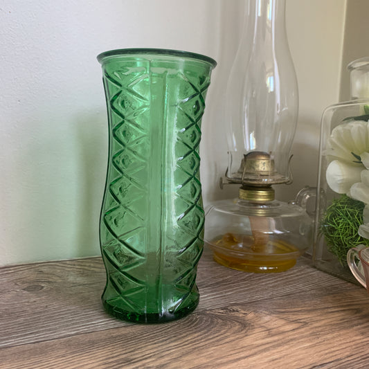 A tall green vase with a pressed pattern of stacked diamonds
