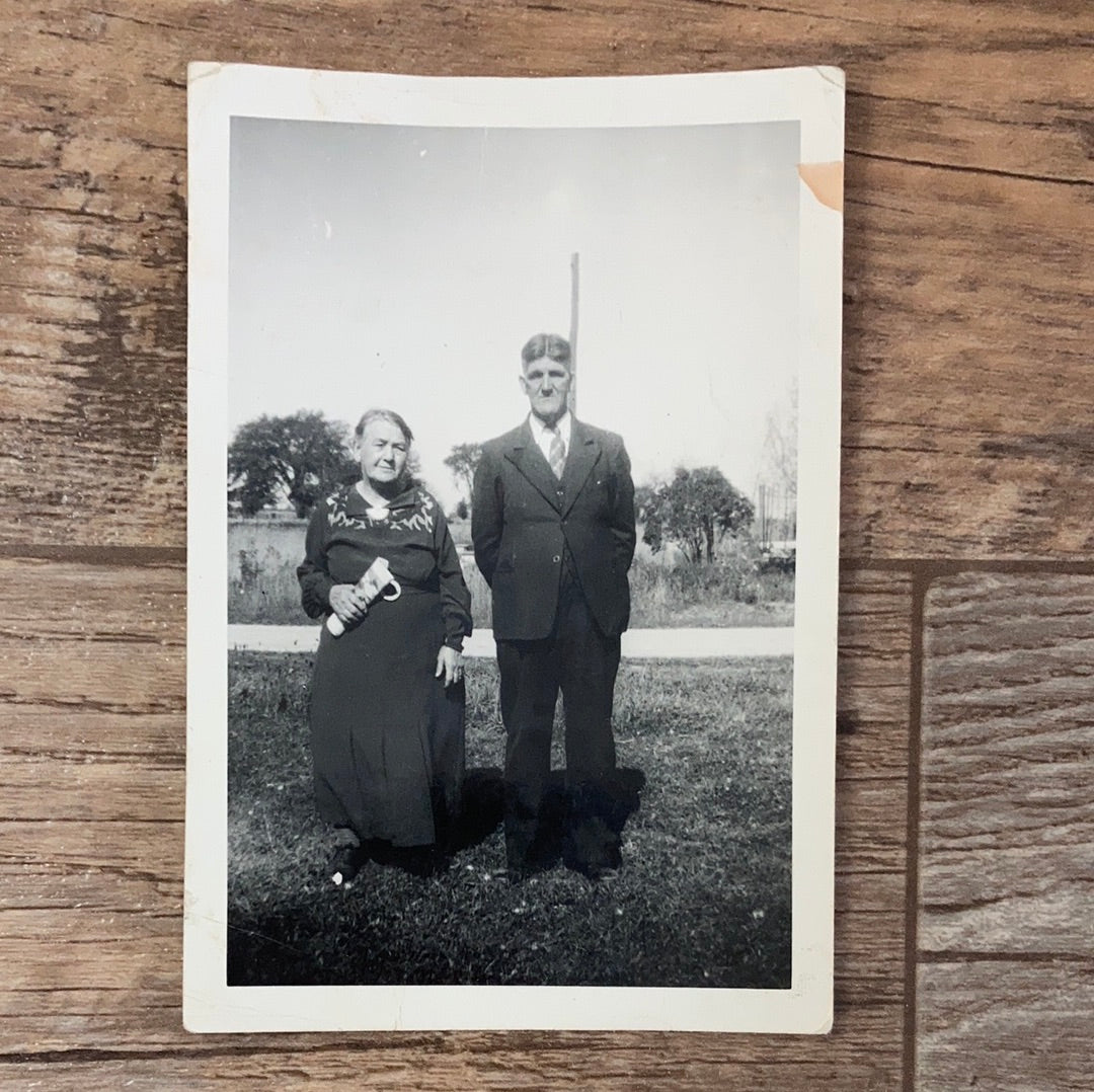 Vintage Photograph of an Older Married Couple standing in a Grassy Park