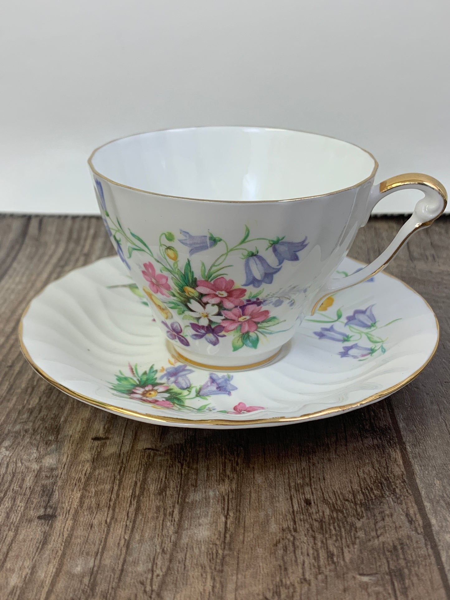 White Vintage Teacup with Floral Pattern Swirled Rib Colourful Flowers