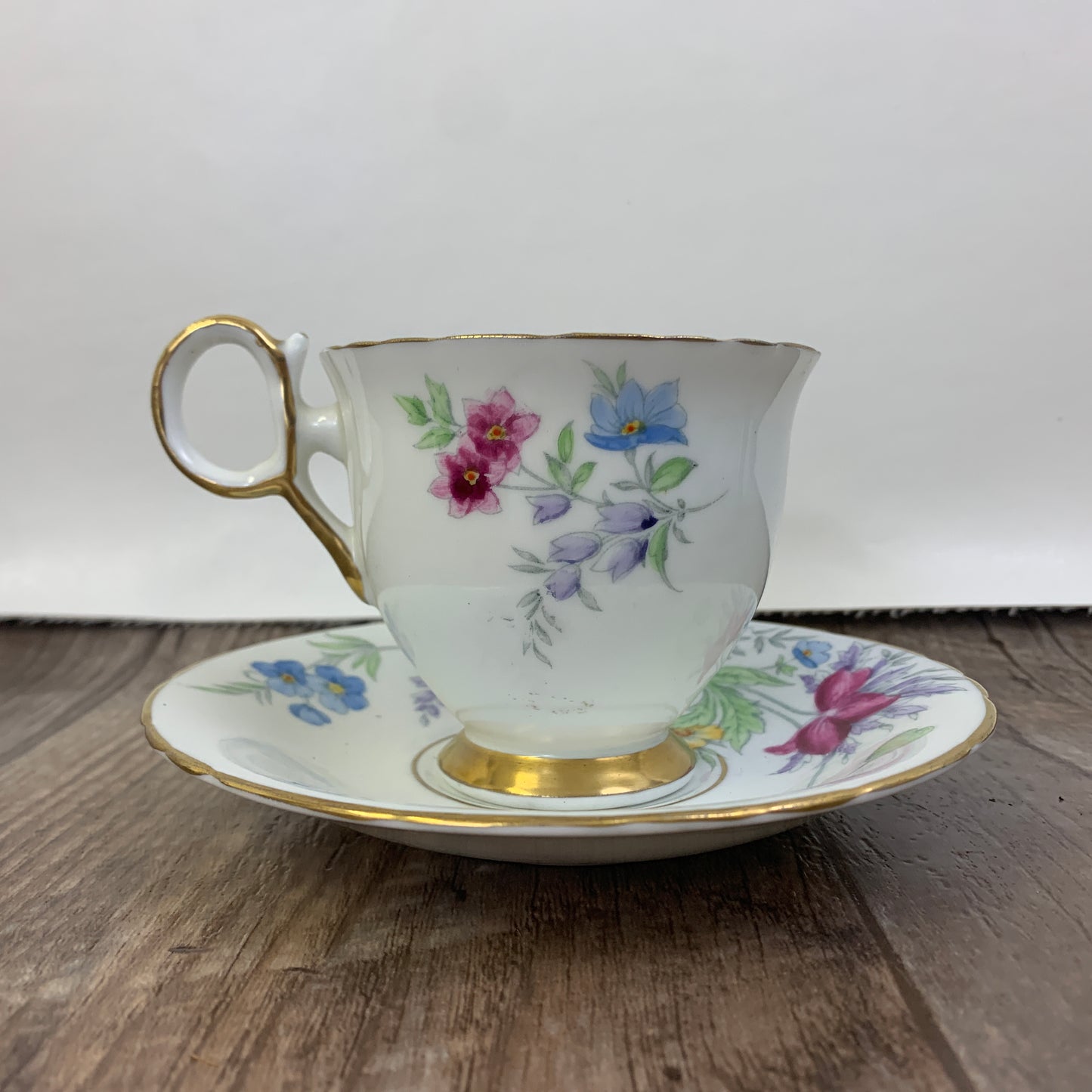 Vintage Teacup Delphine China Hand Painted Tea Cup Pink, Blue, and Yellow Floral Pattern