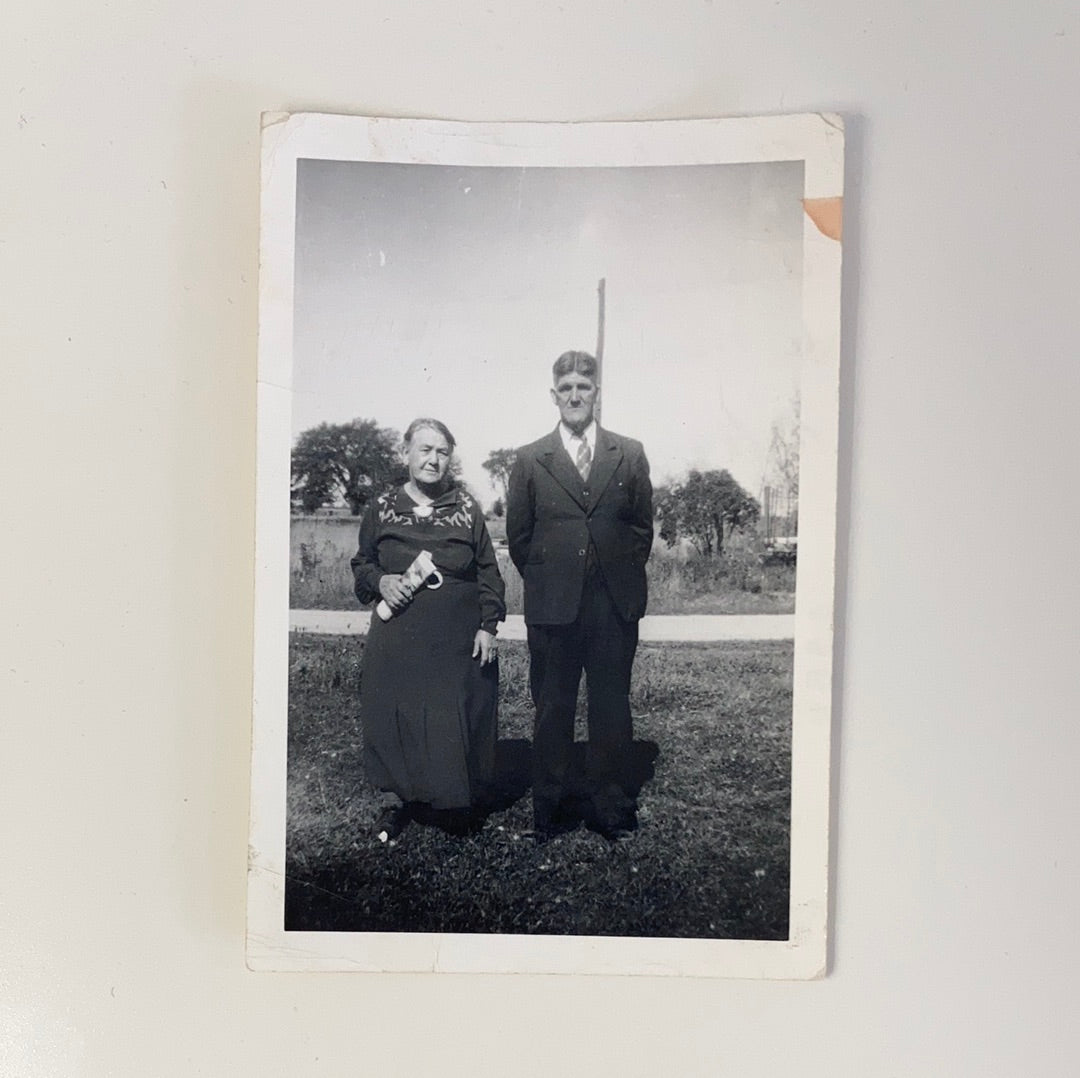 Vintage Photograph of an Older Married Couple standing in a Grassy Park
