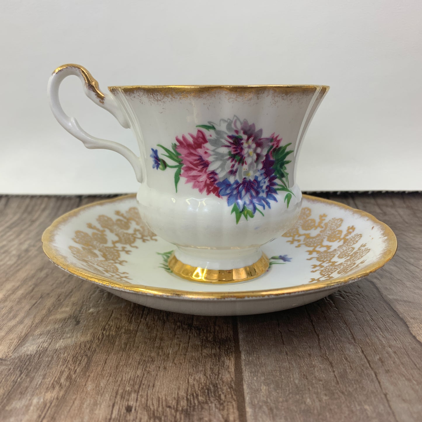 Windsor Bone China Teacup and Saucer with Gold Design, Pink, Blue, and White Floral Pattern