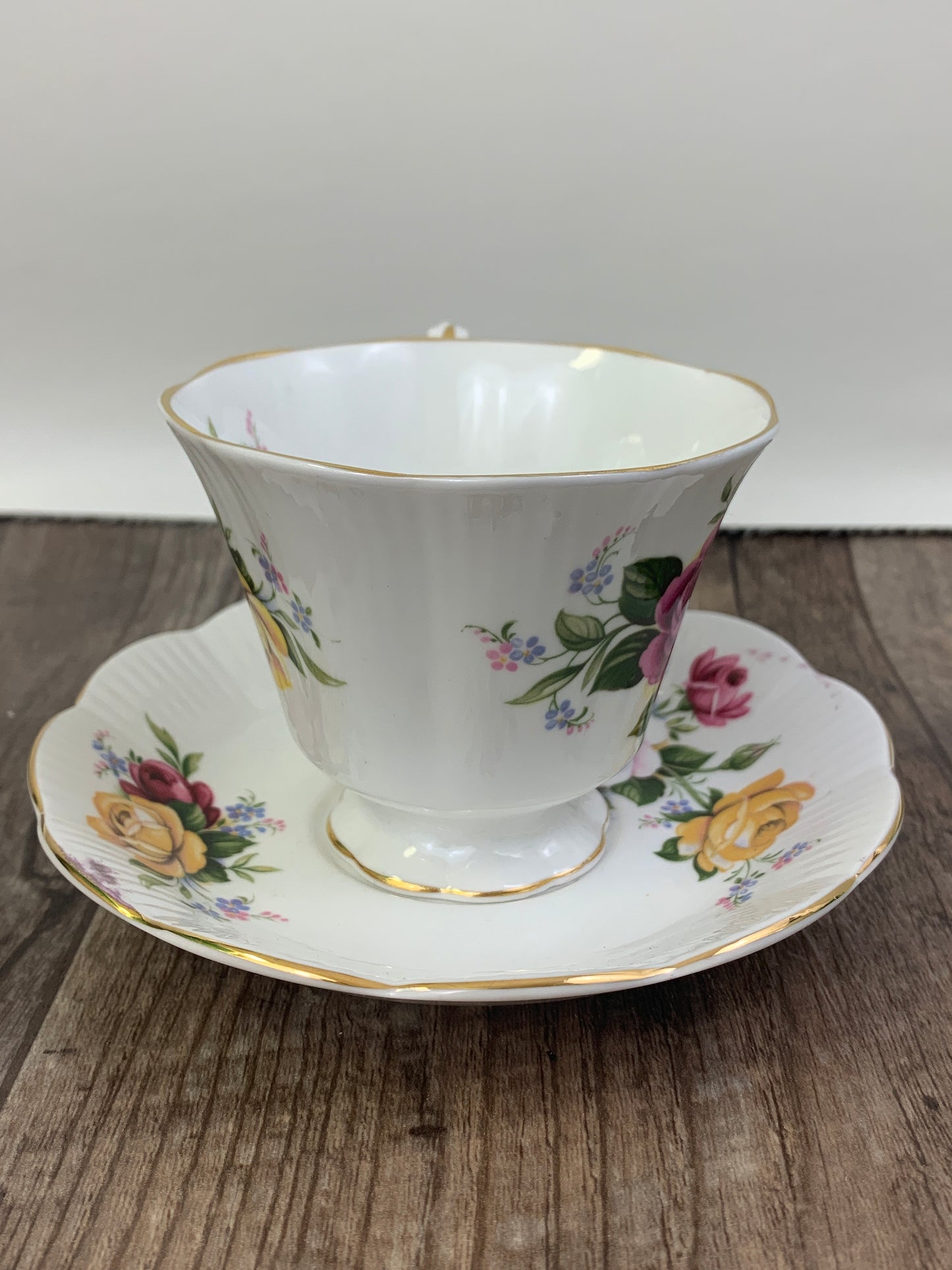 Pink, Yellow, and Red Floral Teacup and Saucer