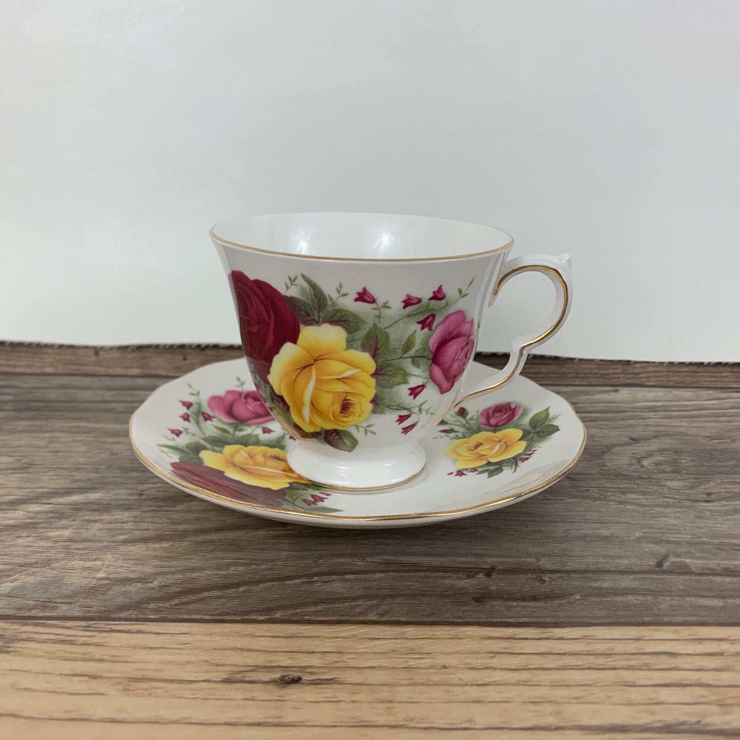 Queen Anne Vintage Teacup with Red, Yellow, and Pink Roses